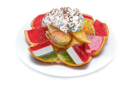 colorful orange jelly on a white plateの写真素材