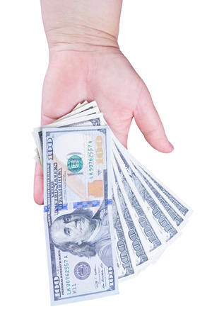 Woman's hand holding money isolated on white backgroundの写真素材