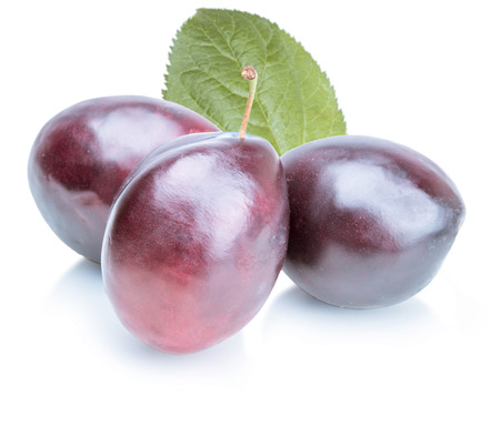 Plums with leaves on white backgroundの写真素材