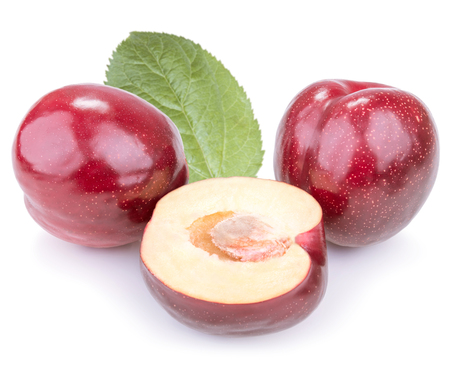 Three plums with leaves on white backgroundの写真素材