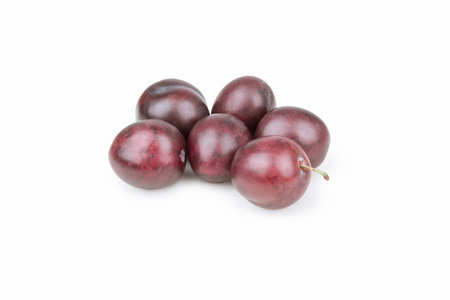 red ripe plum on a white backgroundの写真素材