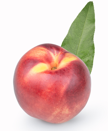 ripe peach with a leaf on a white backgroundの写真素材