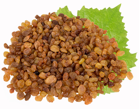 raisins with a leaf on a white backgroundの写真素材