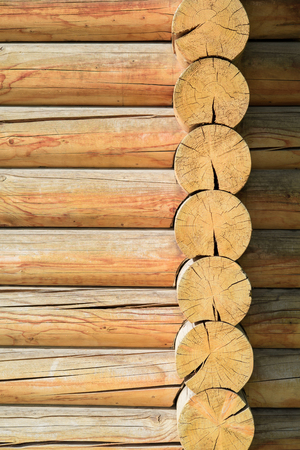 Wooden logs wall of old rural house as backgroundの写真素材