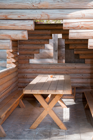 a wooden table with a gazebo logの写真素材