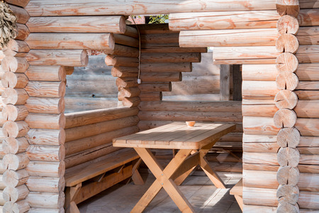 a wooden table with a gazebo logの写真素材