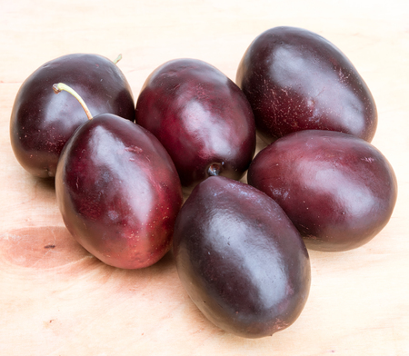 sweet plums on a old wooden backgroundの写真素材