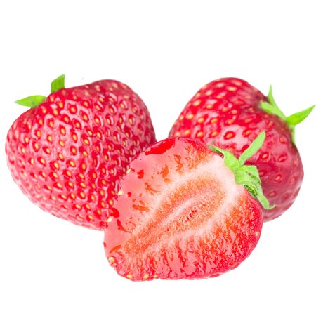 Sliced strawberries isolated on white backgroundの写真素材
