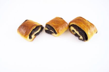 Buns with a poppy filling on a light backgroundの写真素材