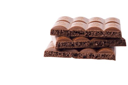 Milk porous chocolate on a light background