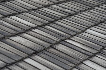 Background of the old roof with wooden boards