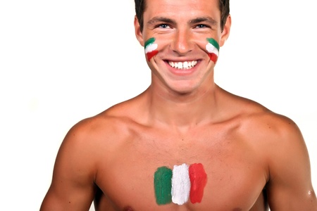 Portrait of an italian football fan with flag on his body and face, isolated on whiteの写真素材