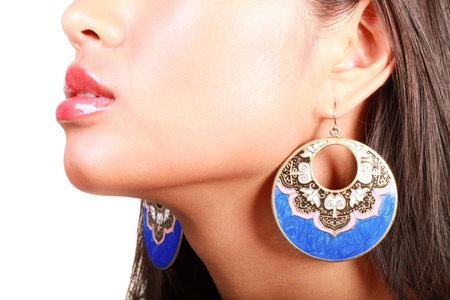 Closeup portrait of a young beautiful asian model with makeup and jewelry