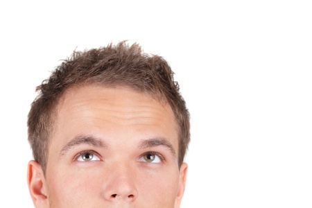 Young trendy businessman looking up. Isolated against white backgroundの写真素材