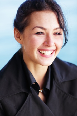 Young happy brunette woman on the beachの写真素材