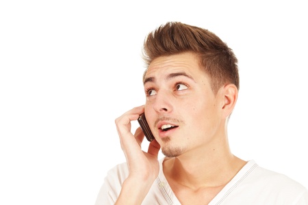 Young man on phone isolated on a white backgroundの写真素材