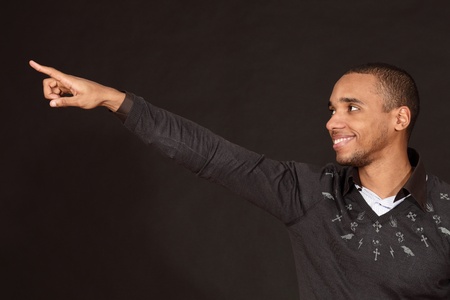 Young african-american man points to smthの写真素材