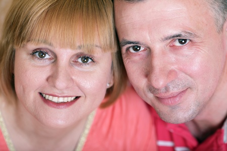 Wife and husband in middle age smiling