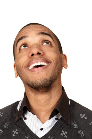Closeup portrait of a happy african-american man looking up at copyspaceの写真素材