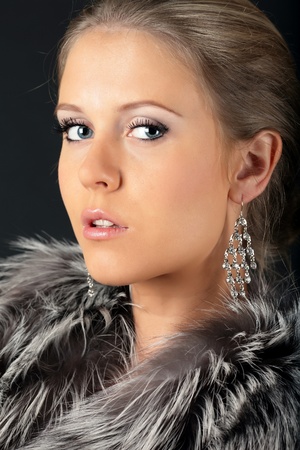 Portrait of a beautiful young woman looking to the cameraの写真素材