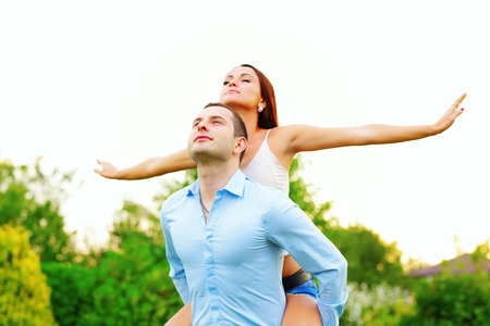 Happy attractive couple enjoying their lifes outdoorsの写真素材