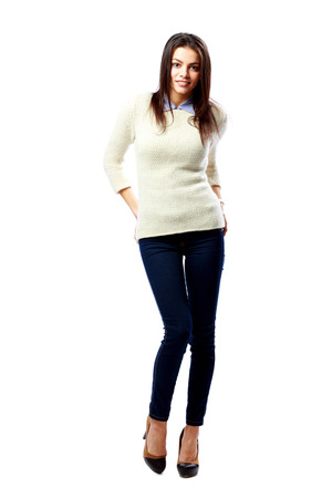 Young cheerful businesswoman standing isolated on a white backgroundの写真素材