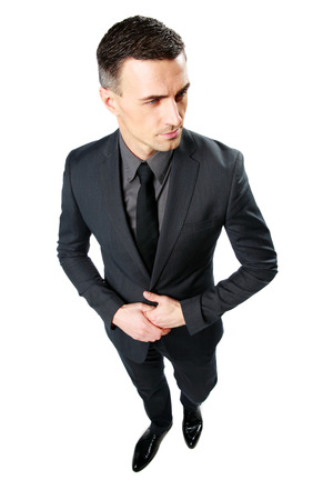 Full-length portrait of a businessman standing isolated on a white backgroundの写真素材