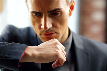 Closeup portrait of a pensive businessmanの写真素材