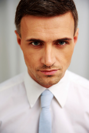 Portrait of a confident businessman in white shirtの写真素材