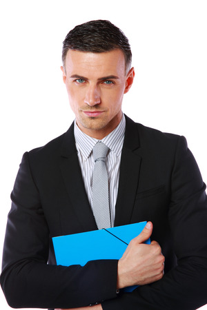 Portrait of a confident businessman holding folder isolated on a white の写真素材
