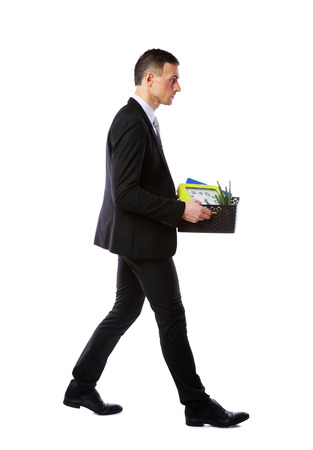 You are fired! Businessman hold box with personal belongings isolated on white backgroundの写真素材