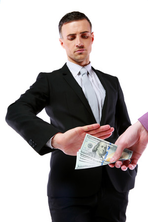 a uncorrupted businessmen refusing money from a bribe isolated on a white backgroundの写真素材