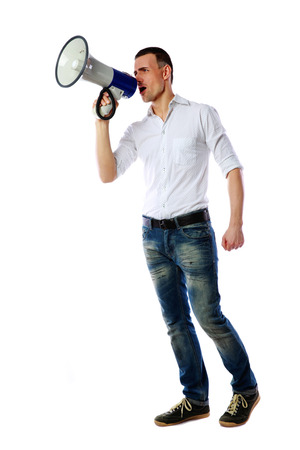 Man shouting through megaphone over white backgroundの写真素材