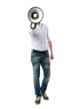 Full length portrait of a man with megaphone over white backgroundの写真素材