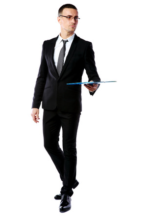 Portrait of a confident businessman holding folder isolated on a white backgroundの写真素材