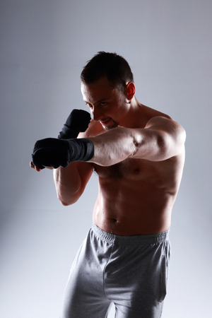 sportsman boxing with his hands wrapped with elastic bandage の写真素材