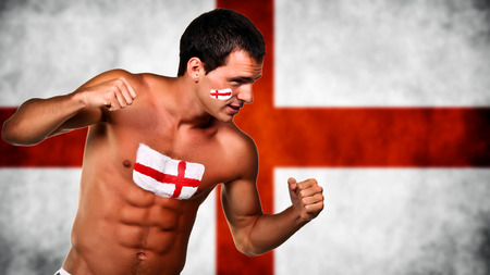 England football fan is ready for fight over england flag backgroundの写真素材
