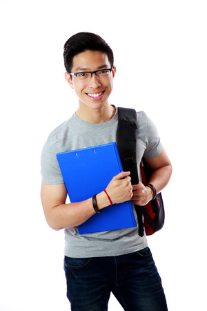 Young student with backpack and notebook standing over white backgroundの写真素材