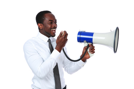 African man yelling through a megaphone isolated on a white backgroundの写真素材
