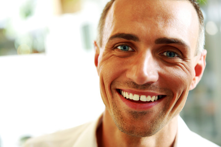 Closeup portrait of a handsome happy manの写真素材