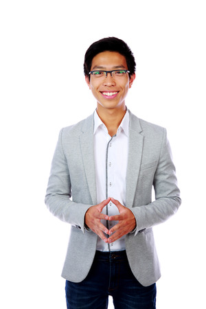 Happy asian man standing over white backgroundの写真素材