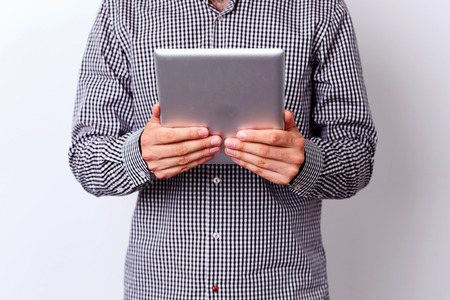 Closeup portrait of a man with tablet computer