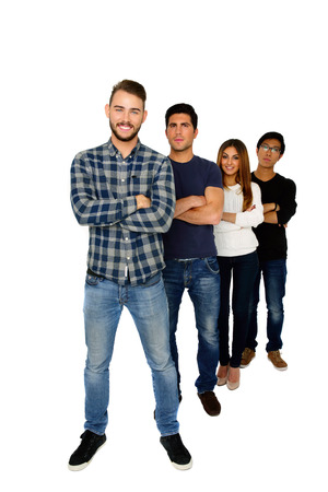 Full length portrait of a students standing in a row over white backgroundの写真素材