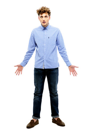 Full length portrait of dissatisfied man over white backgroundの写真素材