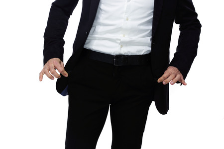 Businessman showing his empty pocketsの写真素材