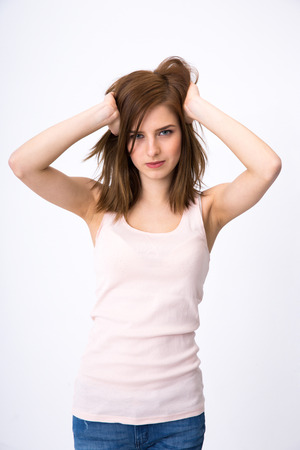 Portrait of attractive woman posing over gray backgroundの写真素材