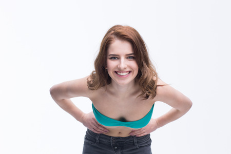 Portrait of a smiling woman posing over white backgroundの写真素材