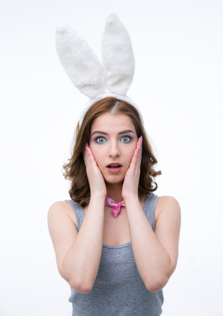 Portrait of a surprised young woman in rabbit earsの写真素材