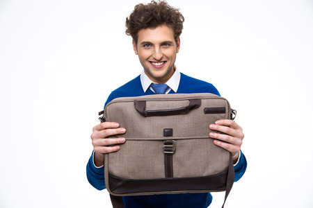 Happy young business man presenting laptop bagの写真素材