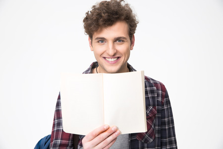 Happy young male student holding blank notebookの写真素材